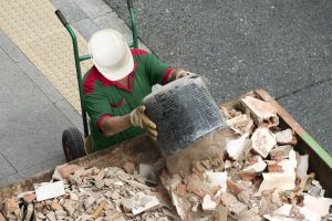 Bricklayer,Mason,Worker,Depositing,Waste,Of,Bricks,And,Tiles,In